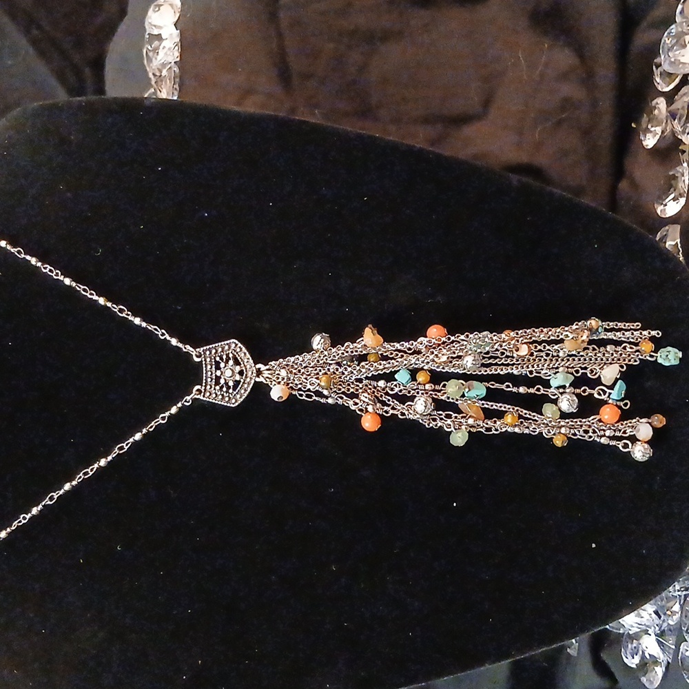 Silver necklace with drop p dant of silver chains and multi colored stones
